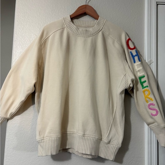Aerie cream oversized sweatshirt with colorful CHEERS on sleeve. Wide ribbed hem - Picture 1 of 15